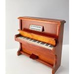 Minature piano and chair, mahogany